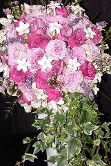 Stephanotis, lavender and wax flower are great choices our wedding florist designed.